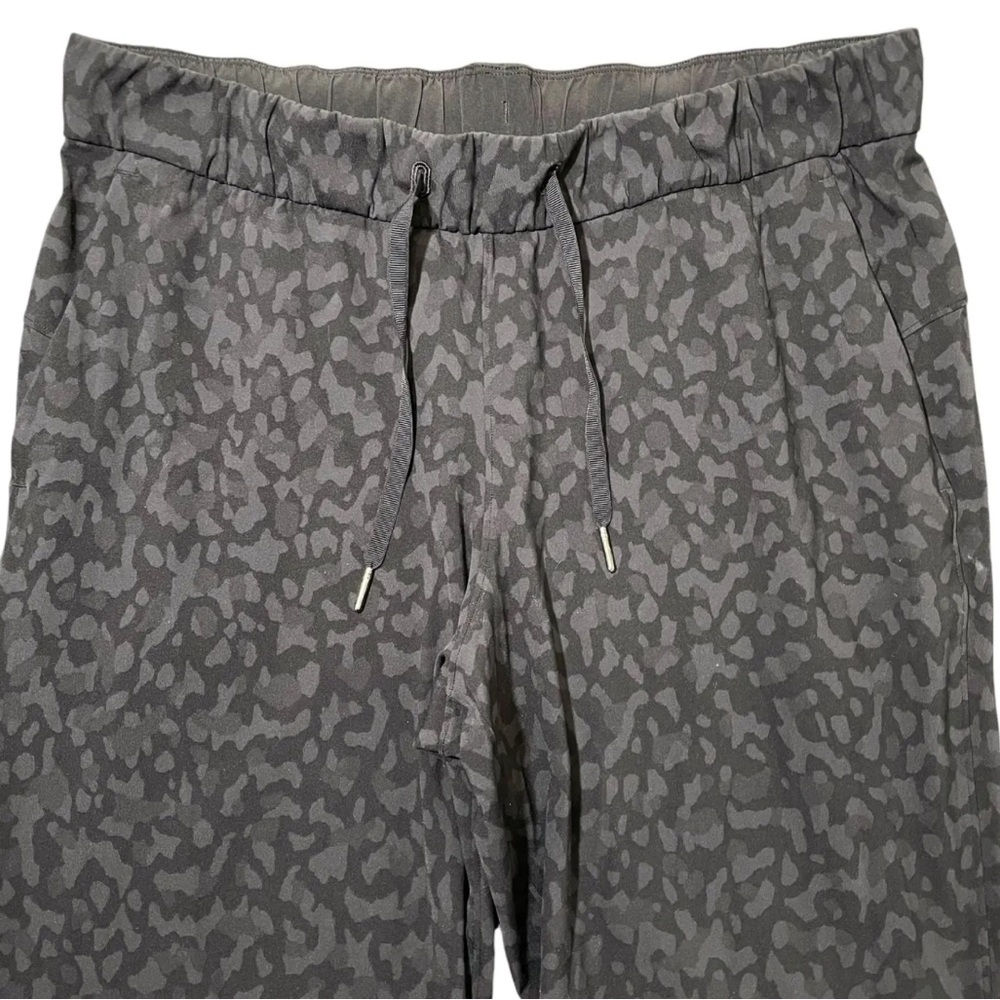Lululemon On the Fly 7/8 Pant. Size 12. Deep gray camo/cheetah print. - Picture 2 of 8